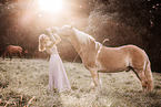 woman and Haflinger horse