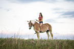 woman and Haflinger horse