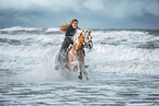 woman and Haflinger horse