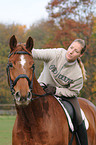 woman rides Hanoverian