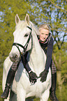 woman rides Hanoverian horse