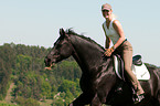 woman rides Hanoverian