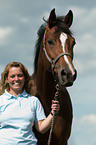 woman with Hanoverian horse