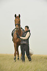 woman rides Hanoverian horse