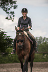 woman rides Hanoverian