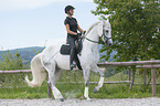 woman rides Hanoverian Horse