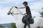 woman rides Hanoverian Horse