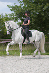 woman rides Hanoverian Horse