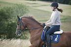 woman rides Hanoverian Horse