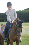 woman rides Hanoverian Horse