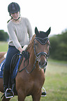 woman rides Hanoverian Horse