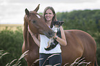 woman with Hanoverian Horse and Chihuahua