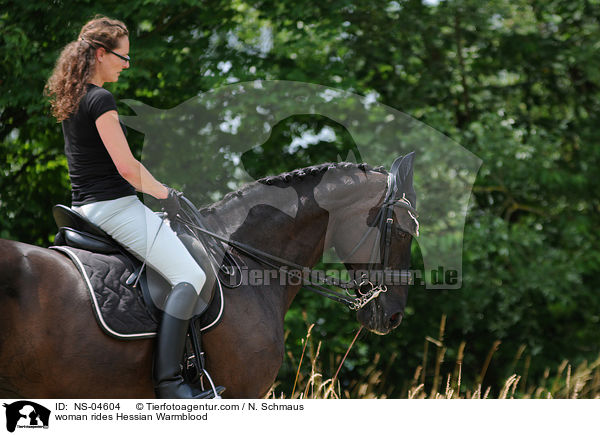 woman rides Hessian Warmblood / NS-04604