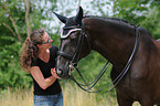 woman and Hessian Warmblood