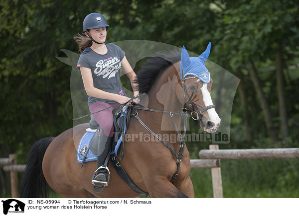 young woman rides Holstein Horse / NS-05994