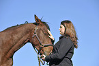 woman and Holsteiner horse