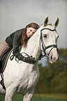 woman rides warmblood