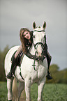 woman rides warmblood