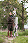 woman and Holstein Horse