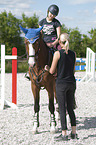 womans with Holstein Horse