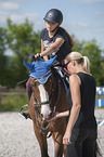 womans with Holstein Horse