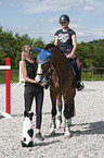 womans with Holstein Horse