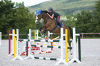 young woman rides Holstein Horse