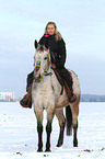 woman rides crossbreed