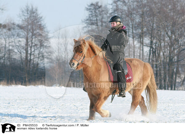 woman rides Icelandic horse / PM-05533