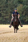 woman rides Icelandic horse