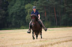 woman rides Icelandic horse