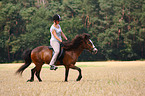 woman rides Icelandic horse