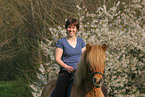 woman rides Icelandic horse