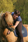 woman rides Icelandic horse