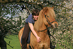 woman rides Icelandic horse