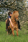 woman rides Icelandic horse