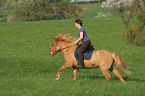 woman rides Icelandic horse