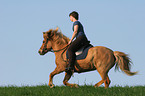 woman rides Icelandic horse