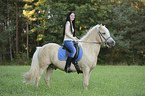 woman rides Icelandic horse