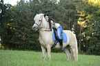 woman rides Icelandic horse