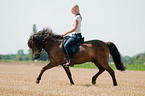woman rides Icelandic horse