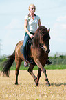 woman rides Icelandic horse