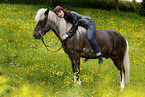 woman rides Icelandic horse