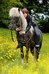 woman rides Icelandic horse