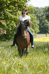 woman rides Icelandic horse