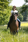 woman rides Icelandic horse