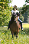 woman rides Icelandic horse