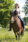 woman rides Icelandic horse