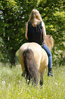 woman rides Icelandic horse