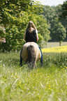 woman rides Icelandic horse